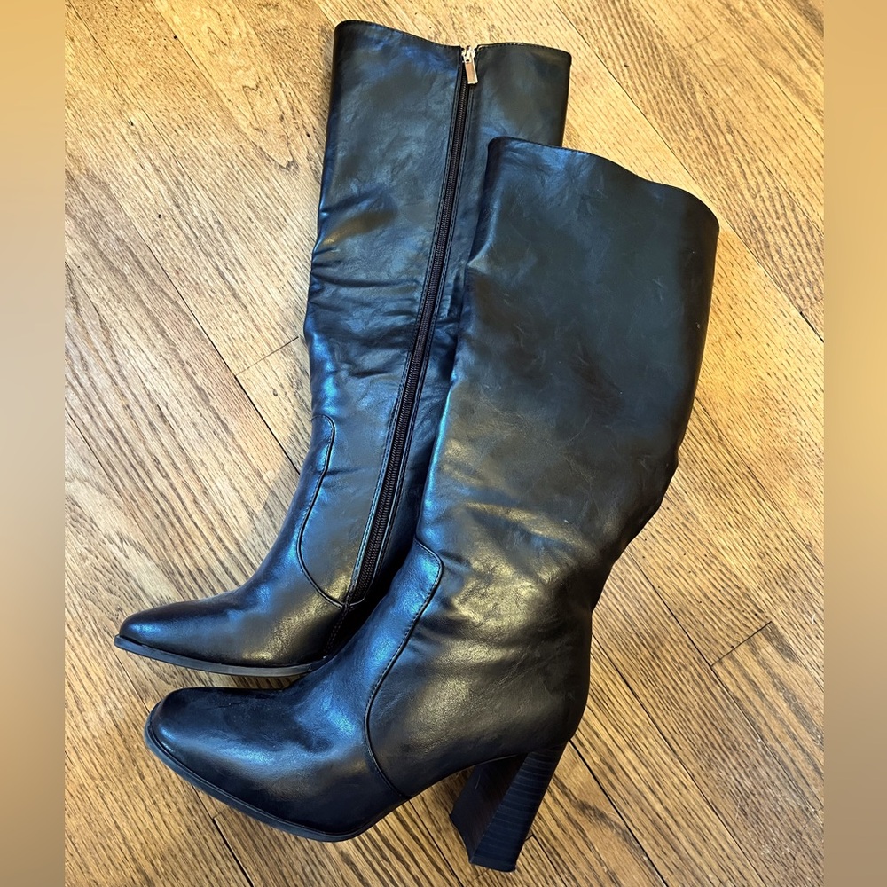 Knee high black boots.  Size 8.5